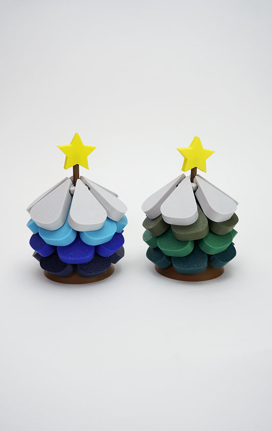 Two 3D printed Christmas tree coasters in blue and green color variations