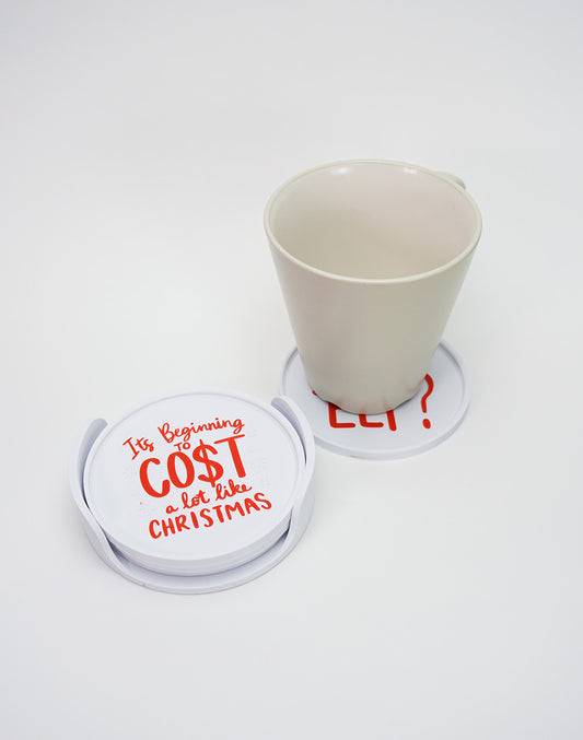 Cup placed on a 3D printed Christmas funny coaster from a set of four